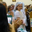 Amber walks down the aisle with her communion group